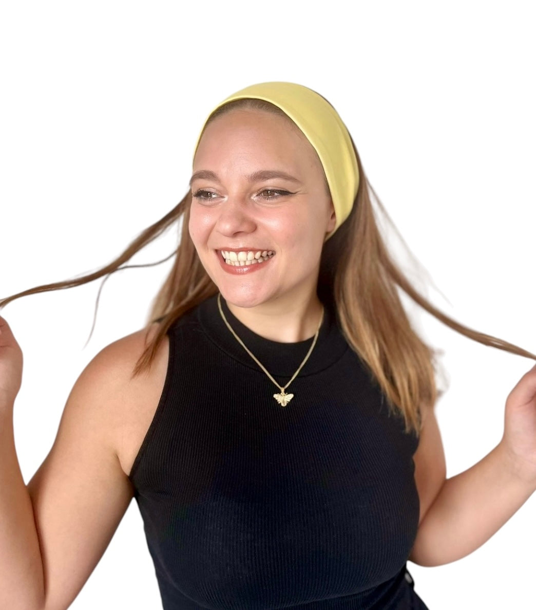 Side view of Sunny Yellow Laze Headband showing soft stretch fit and bright color.